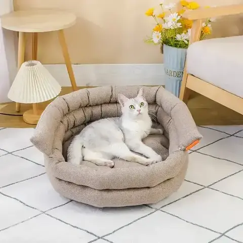 Cat resting in textured round bolster pet bed