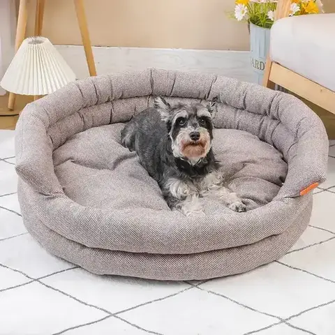 Textured round bolster bed in home setting